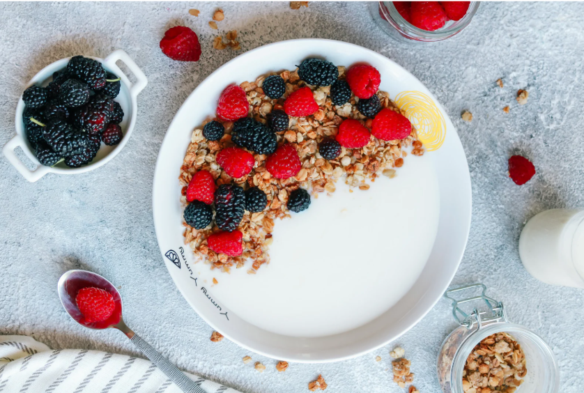 Healthy Baby and Toddler Snacks. Healthy Toddler Snacks. No added sugar toddler snacks. Sustainable snack containers. A large bowl of yogurt with blackberries, raspberries and granola. 