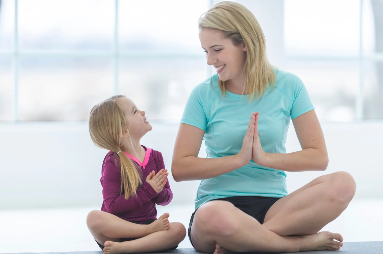 Mindful Prenting. Toddler Tantrums. How to handle toddler meltdowns. How to handle toddler tantrums. Parenting Tips. Mother and daughter do yoga.