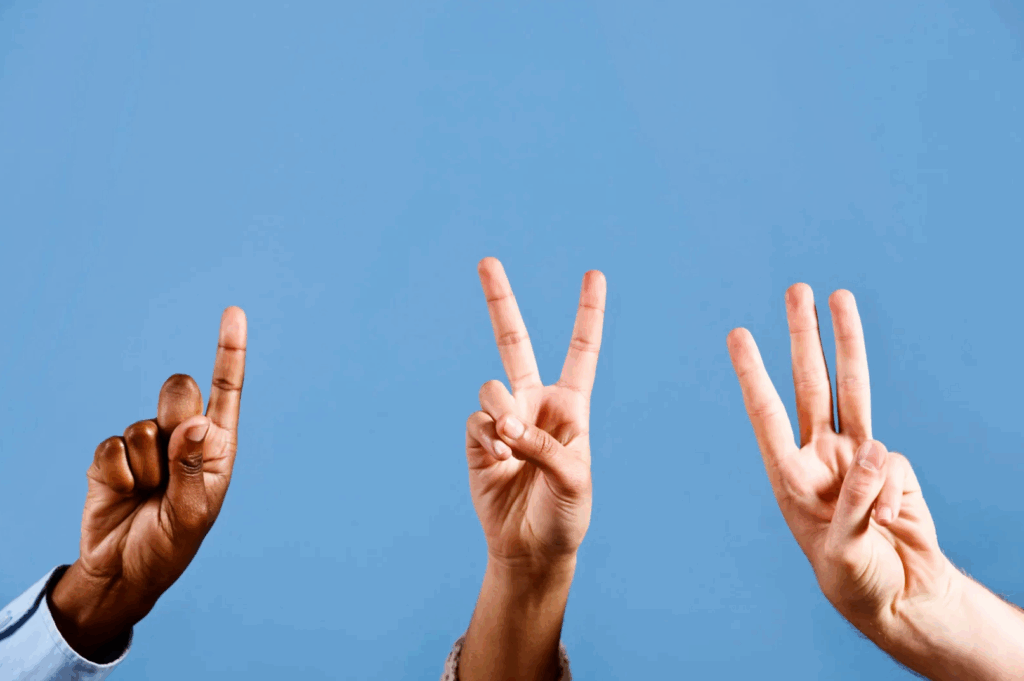 3 hands in the air each representing the numbers 1, 2, and 3.